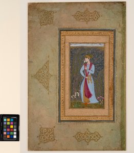 A handsome youth holding a narcissus sprig by Farrukh Beg