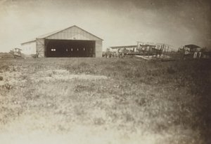 Airplanes in a field by Fedele Azari