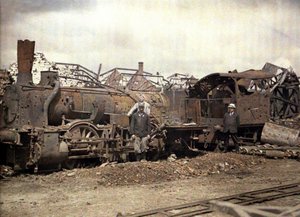 Burnt out locomotive and railway car in front of the ruins of the heavily damaged Vauxrot distillery, Cuffies, Aisne, France