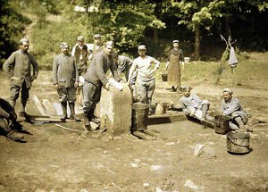 Group of French soldiers doing laundry at a well, Soissons, Aisne, 1917 by Fernand Cuville