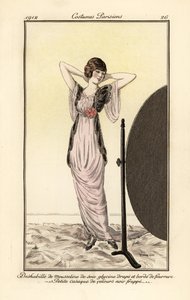 Woman in lilac muslin silk dress with black velvet vest looking at herself in a mirror