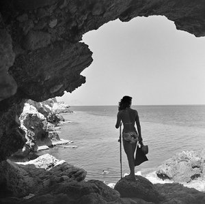 Bather on the Cliff Looking Down at the Sea near the Village of Aspra, near Palermo, Sicily, ca 1950 by Fosco Maraini