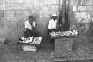Street vendors in a street in Jerusalem by Fosco Maraini