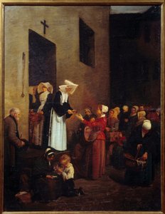 Charity. Nuns distribute food to the poor on the street