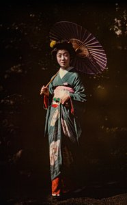 Japanese woman holding parasol and wearing kimono, early color autochrome, circa 1916 by Franklin Price Knott