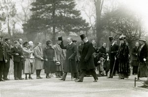 King George V raising his hat to the crowds at the front of his entourage, during a visit to London Zoo to officially open the Aquarium, April 1924 by Frederick William Bond