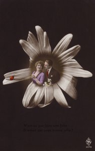 A young couple in the centre of a flower with ladybird by French Photographer