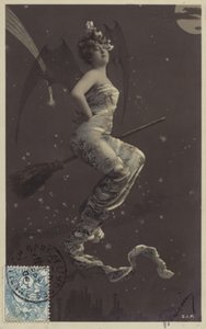 A Young Woman Sitting on a Broomstick and Flying Over Rooftops by French Photographer