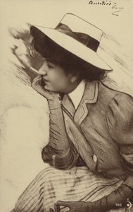 A young woman wearing a hat and smoking