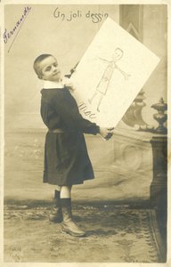 Boy with a drawing by French Photographer