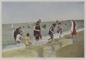 Children playing with a rope at the beach