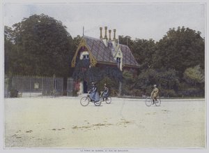 Cyclists riding past the Porte de Madrid in the Bois de Boulogne, Paris