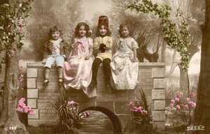Girls and Boys Sitting on Edge of Bridge