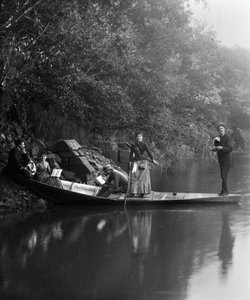 Group of friends, on a walk, resting on a boat