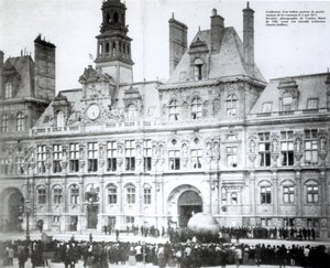 Inflating a balloon with the declarations of the Commune attached to it outside the Hotel de Ville, Paris by French Photographer