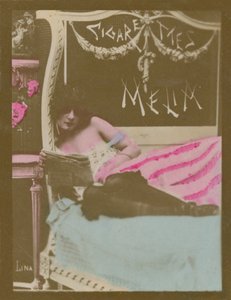 Lina, girl on bed reading newspaper