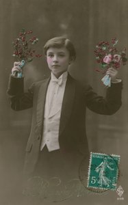 Postcard of a boy in white tie and tails holding flowers and berries, sent in 1913
