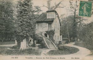 The mill at Hameau de la Reine, a rustic retreat built for Marie Antoinette in the park of the Chateau de Versailles near the Petit Trianon. Postcard sent in 1913