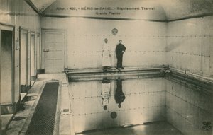 Two men standing in the thermal baths at Neris les Bains in France