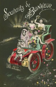 Women throwing flowers from a motor car by French Photographer
