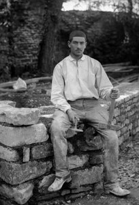 Young man employed in the restoration of the Abbey of Septfontaines, near Bourmont in Haute-Marne, around 1880. Photography. Ducos Collection.