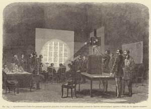 Enlargement using a powerful projection device of a photographic film carrying microscopic messages brought to Paris by carrier pigeons (engraving) by French School