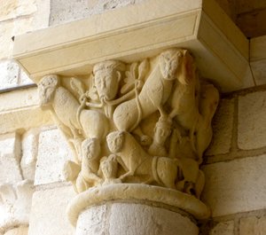 Capital depicting lions and faces