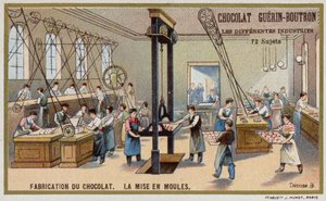 Chocolate manufacturing. Putting chocolate into moulds by French School
