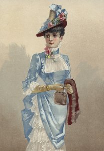 Elegant young lady in blue dress, carrying small handbag