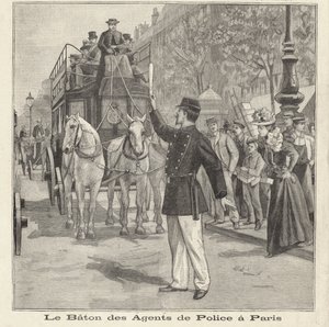 French policeman using his baton to direct traffic on the streets of Paris