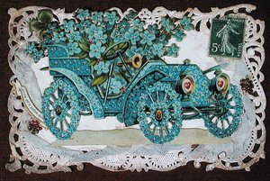 Friendship greeting card depicting a car covered in flowers, early 20th century