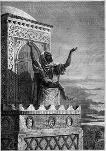 Islam: Muezzin calling the faithful to the evening prayer from the minaret of a mosque in Africa