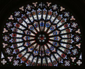 Rose window depicting Christ surrounded by the twelve Apostles and Evangelist symbols