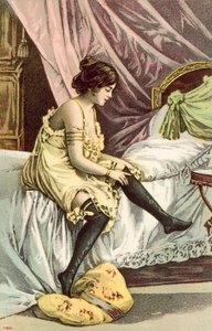 Semi-clad girl, sitting on bed, adjusting her stockings