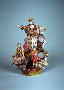 Statuette of women and children grouped on a rockery