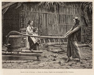 The rice mill, in front of a farmer
