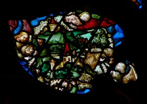 The west rose window depicting a scene from the Book of Revelation: Angels holding back the wind from the land and the ships of the sea by French School