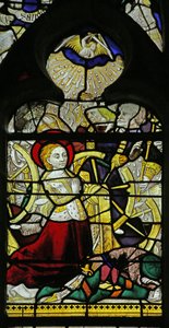 Window depicting St Catherine praying and Angels breaking the wheel by throwing stones