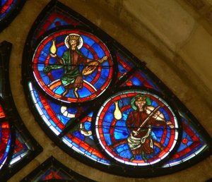 Window depicting the Elders of the apocalypse with musical instruments