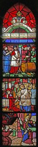 Window depicting the Life of St Remi. Below: delivers a possessed soul. Centre: is offered the bishopric of Reims (engraved) Above: miracle of wine at Cernay by French School