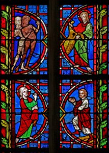 Window w30 depicting Adam and Eve given clothes