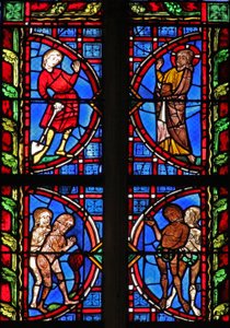Window w30 depicting God with Adam carrying a spade; Adam and Eve try to hide their nakedness