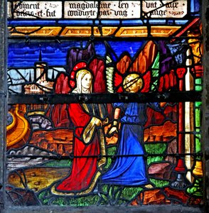 Window depicting Mary Magdalene; she goes into exile and is guided by an angel