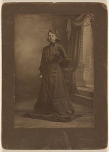 Portrait of a Young Woman in Long Black Dress, Standing