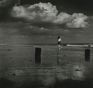 Kid playing with the waves at the beach by Godfrey Macdominic