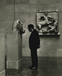 Man looking at sculptures at the British Museum, London 1950s