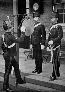 Striking the Gong at the Main Gate of the Aldershot Cavalry Barracks, Hampshire by Gregory and Co