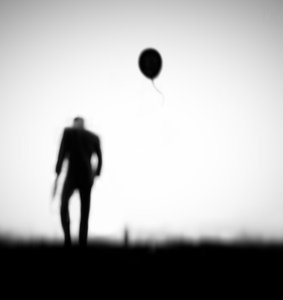 Man And Drifting Balloon