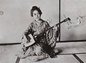 A Geisha playing the Samisen by Herbert Ponting