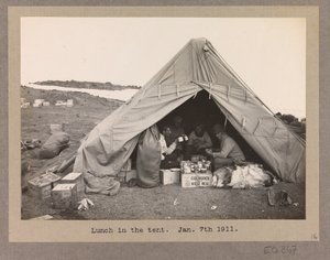 Four Expedition Members Having Lunch in a Tent by Herbert Ponting